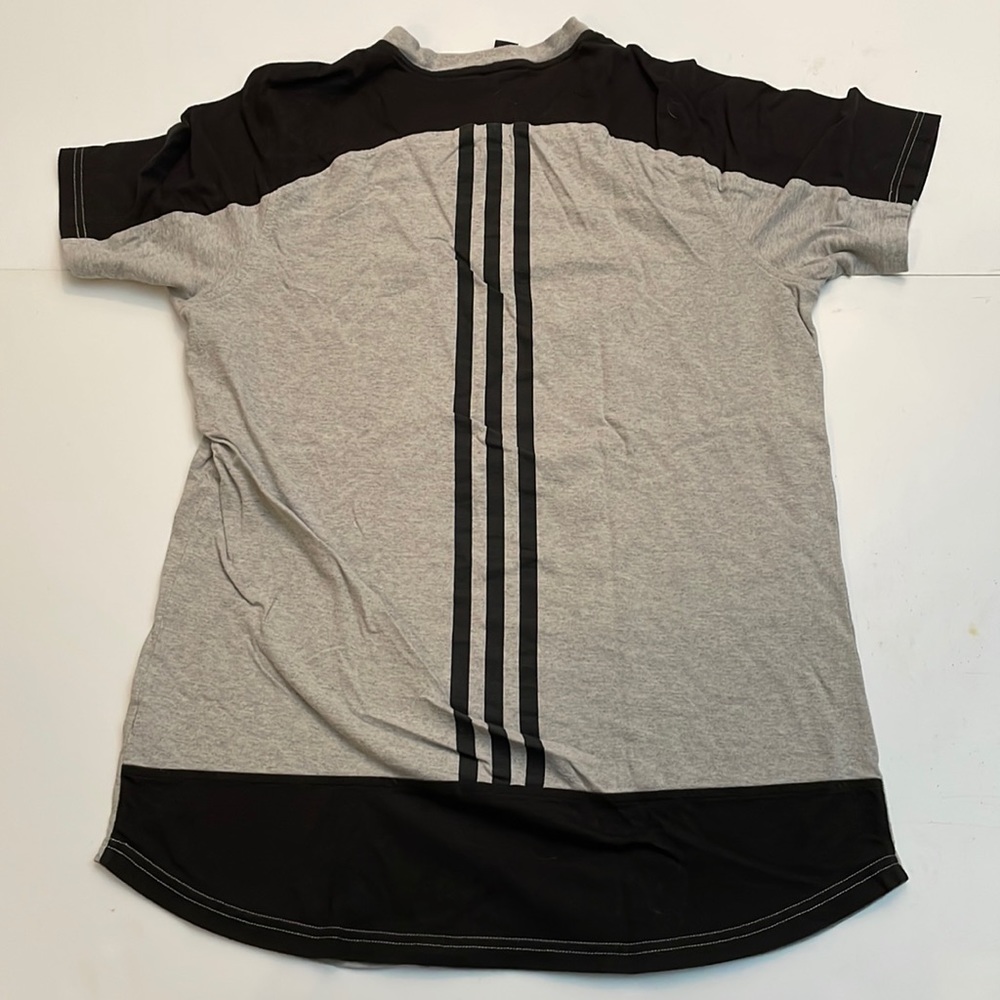 Back of a print straight Adidas T-shirt size large curved hem
